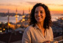 A close-up, side profile of a happy person with a brilliant, perfect smile. In the beautifully blurred background, the sun sets over the city of Istanbul, Turkey, creating a warm, golden glow.