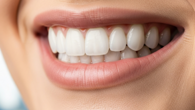 A close-up, photorealistic image of a person's mouth showcasing a perfect, bright white smile, indicative of dental veneers. The background is an extremely blurred, out-of-focus hint of a Canadian cityscape or natural landscape.
