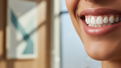 Close-up of a person smiling confidently, revealing straight, perfectly aligned teeth, with clear dental aligners subtly visible. The background is a blurred, modern dental office, emphasizing a professional and clean environment relevant to dental care costs.