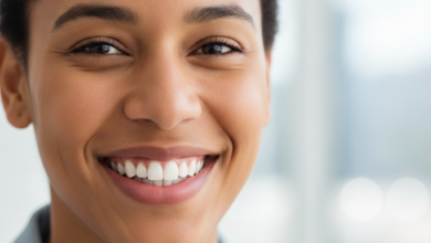 Close-up of a diverse Canadian person smiling confidently, showcasing perfectly aligned, bright white teeth and healthy gums against a softly blurred, modern background with a subtle hint of a cityscape.